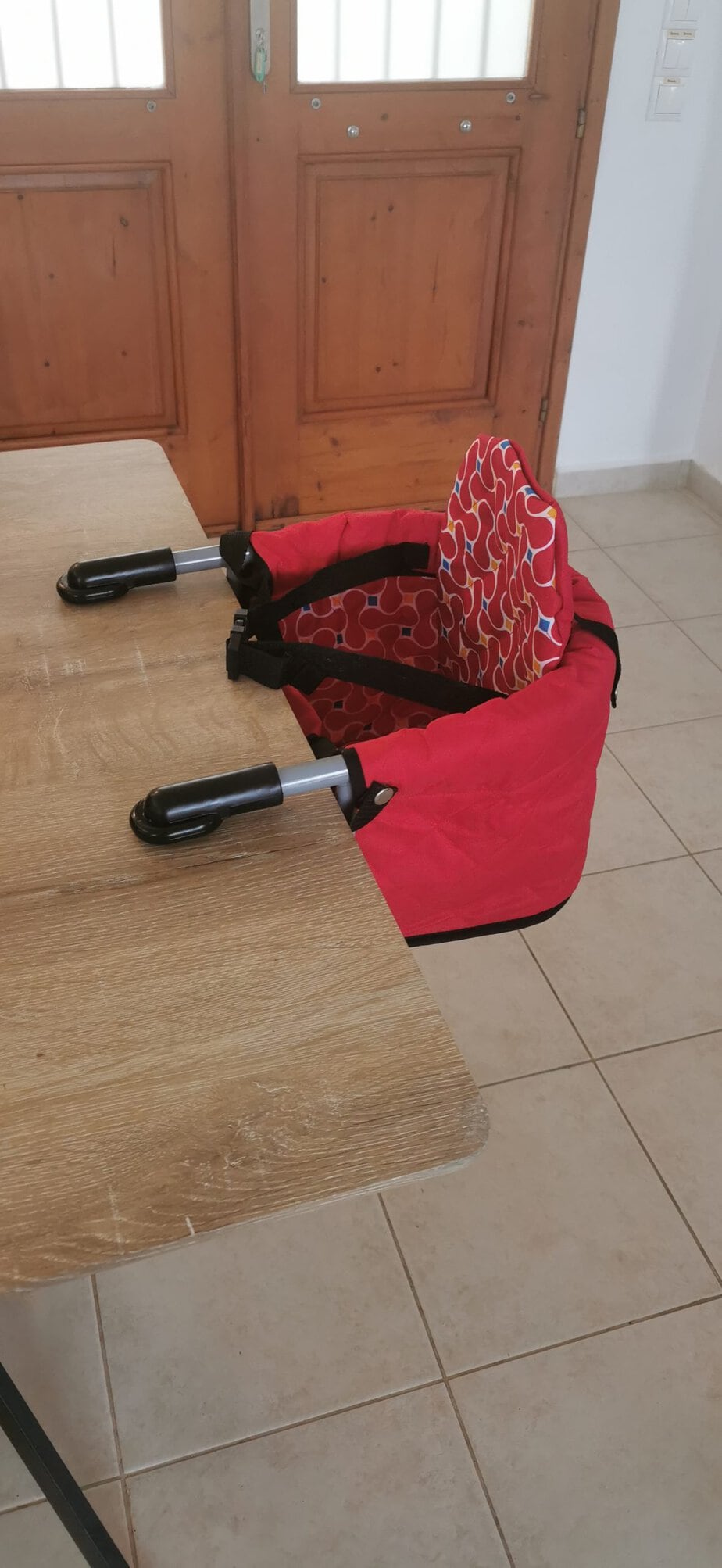 Red table seat available for younger guests at Villa Koumos