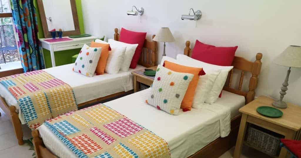Colourful flexible bedroom that can be arranged with three beds at Villa Koumos