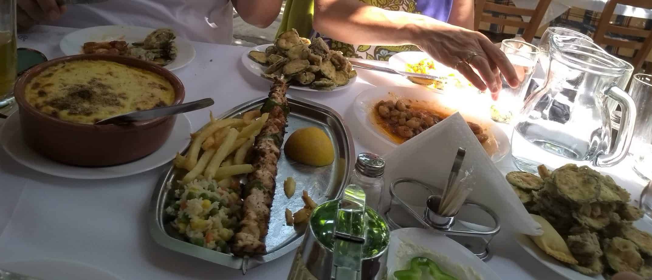 Traditional Cretan meal served at a local taverna near Villa Koumos