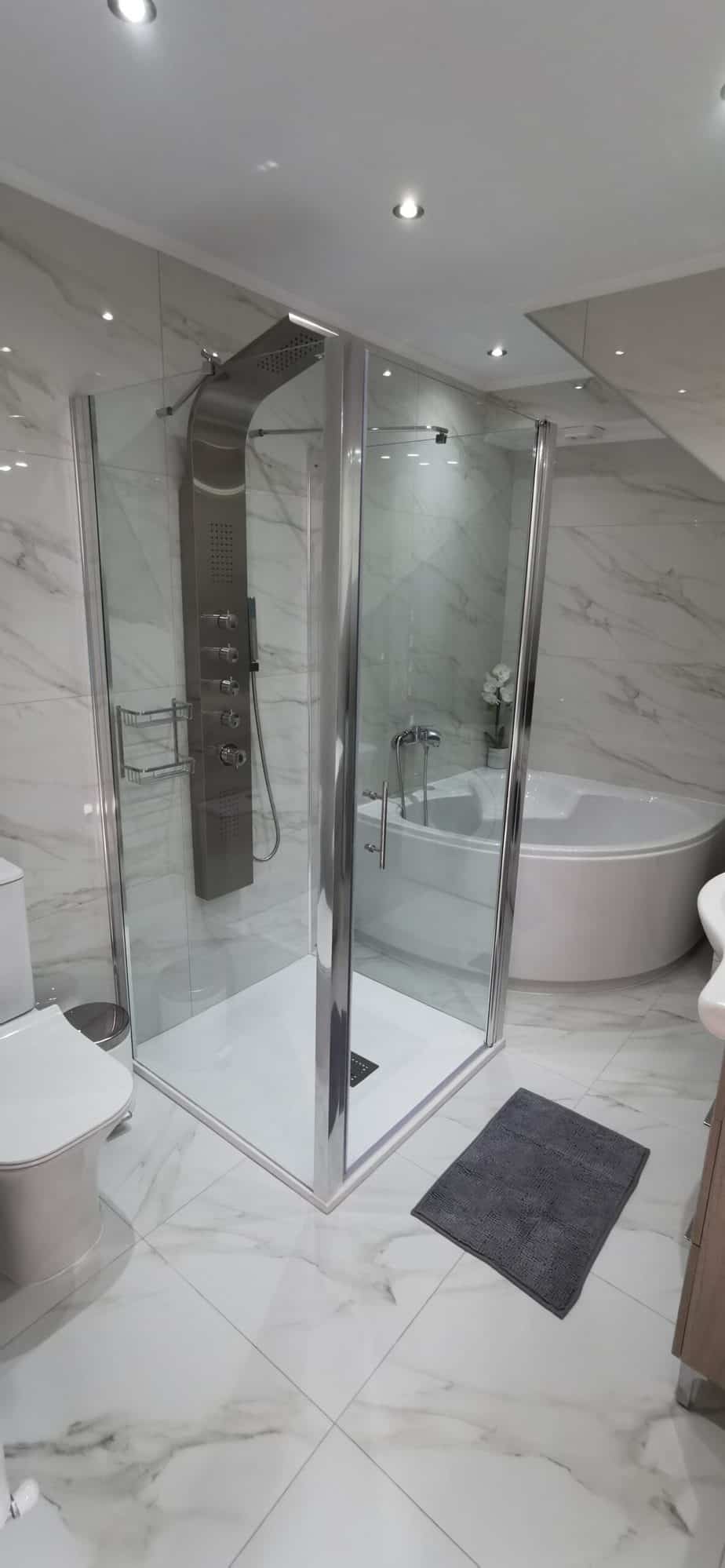 Main bathroom with corner bath and separate shower cubicle at Villa Koumos