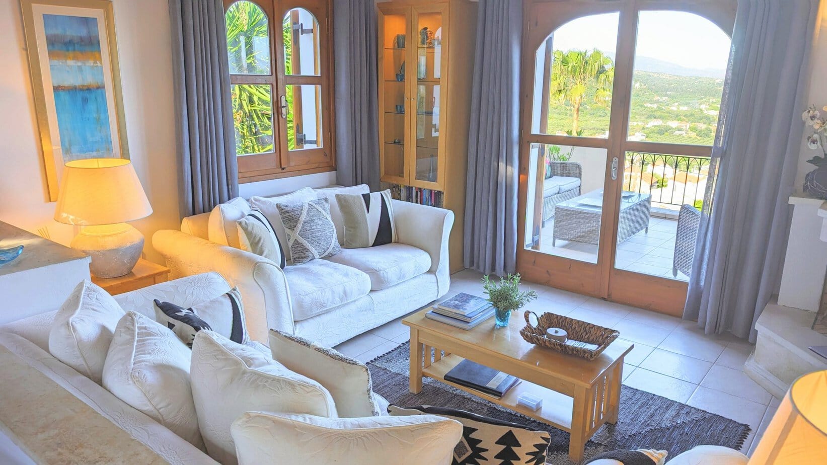 Bright living room at Villa Koumos with comfortable seating and large windows