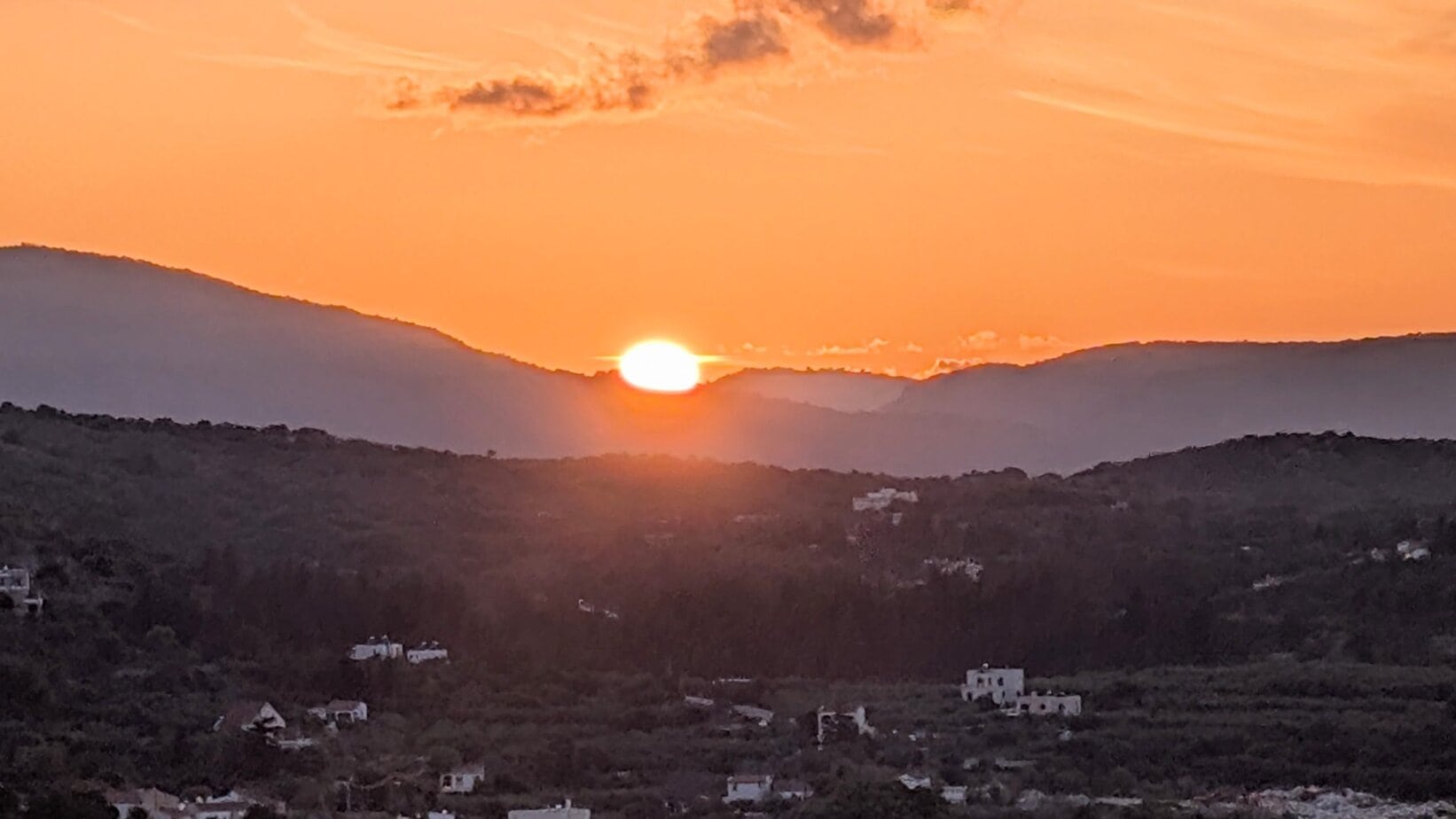 Sunset over the mountains seen from Villa Koumos