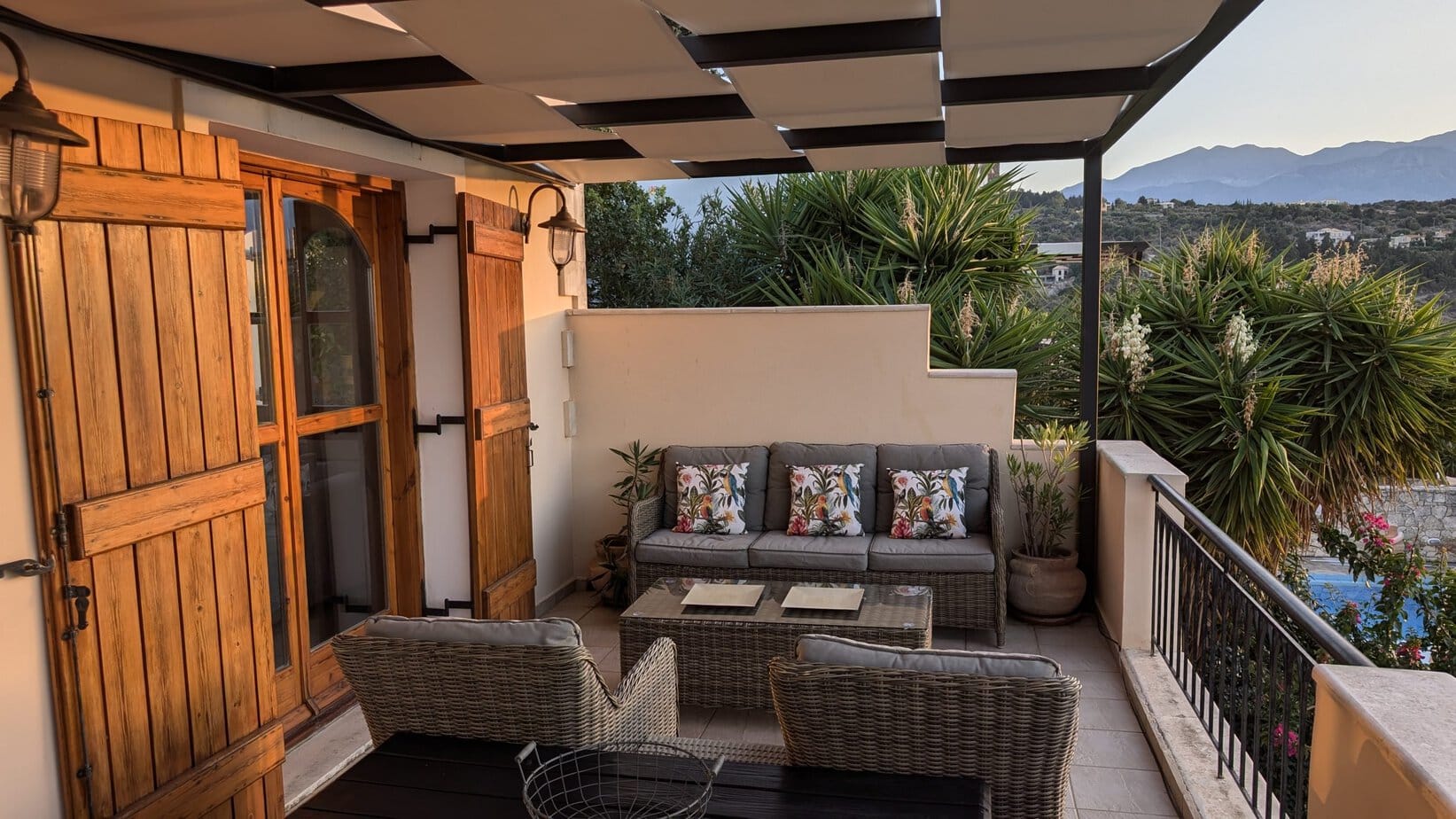 Comfortable veranda lounge with mountain views at Villa Koumos