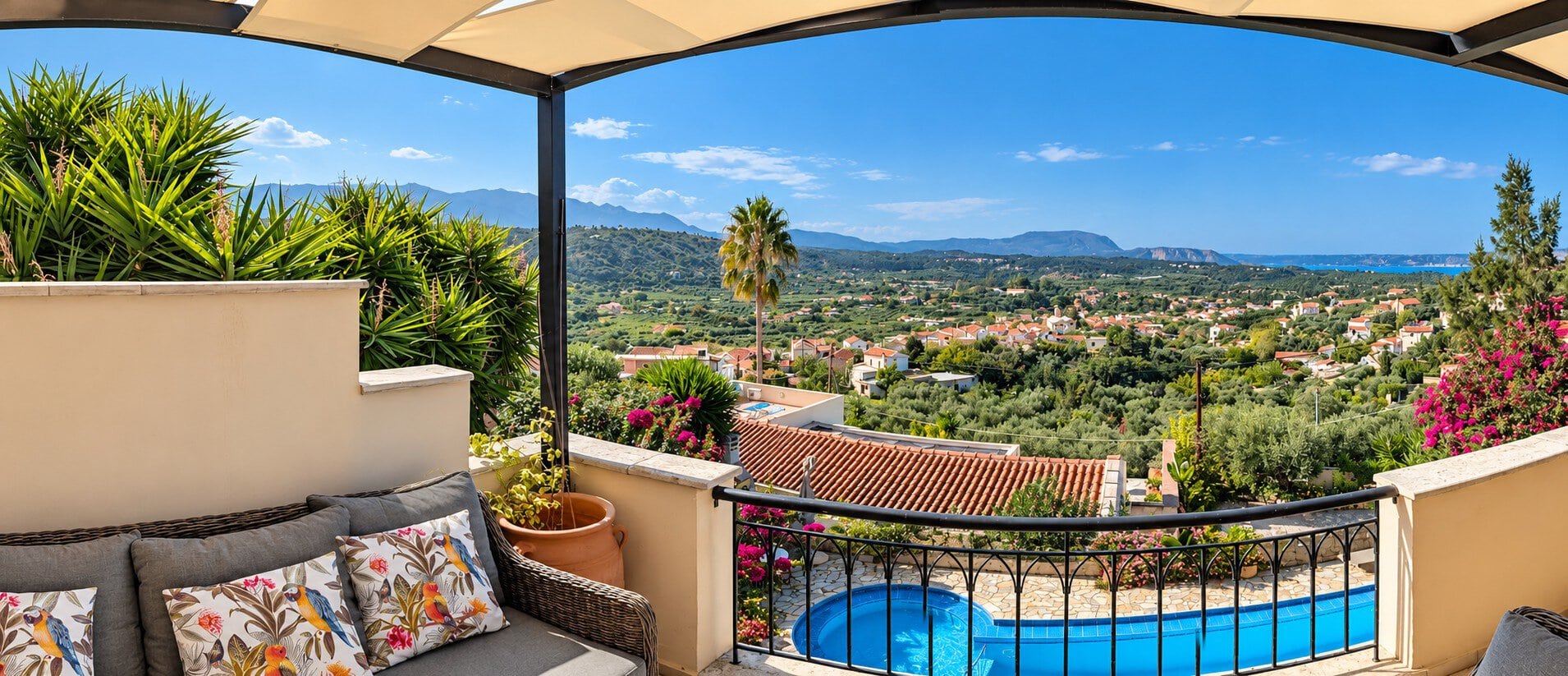 Wide panoramic view from Villa Koumos over the countryside, mountains and sea near Gavalochori, Crete